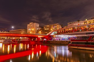 Ships anchoring in the Danube Canal, behind the illuminated Franz-Josefs Quay and the