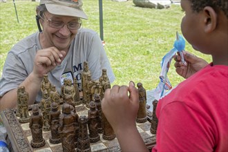 Detroit, Michigan, A chess game at the annual 'Summer Sizzler' picnic and party held by two Detroit