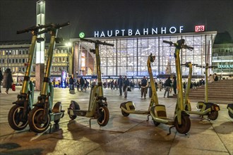 Cologne Central Station, station forecourt, evening, parked e-scooters, North Rhine-Westphalia,