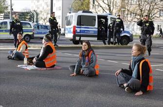 Activists of the Last Generation have taped their hands on a street, Berlin, 24 04 2023