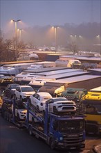 Heavy traffic on the A2 at the Bottrop-Süd service area, overcrowded lorry parking in the evening,