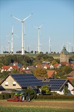 Wind farm above the village of Lichtenau, self-proclaimed energy town, houses with photovoltaic