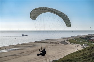 Paragliders along the dunes of Zoutelande, in Zeeland, South Holland, Netherlands