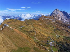 The Sas Rigais peak of the Odle group, alpine meadows, drone shot, Val Gardena, Dolomites,