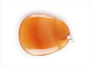 Orange onyx pendant isolated on white background, close up