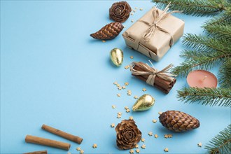 Christmas or New Year composition. Decorations, box, cinnamon, cones, fir and spruce branches, on a