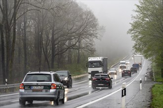 Traffic on a country road in the rain, B229, spring, near Radevormwalde, Oberbergischer Kreis,