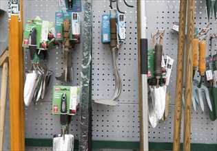 Display of gardening tools on sale, The Walled garden plant nursery, Benhall, Suffolk, England, UK