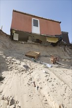 March 2018, Clifftop property collapsing due to coastal erosion after recent storm force winds,