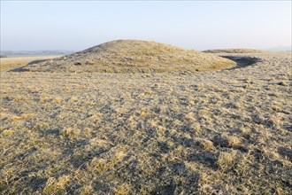 Bronze Age bowl barrow on Windmill Hill, a Neolithic causewayed enclosure, near Avebury, Wiltshire,