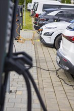 Electric cars at charging stations, Dresden, Saxony, Germany, Europe