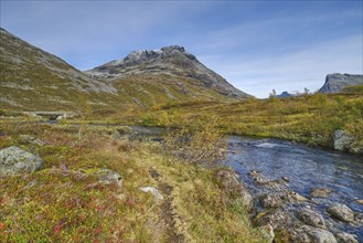 Autumn in Reinheimen National Park, mountains with river in Valldalen valley, Møre og Romsdal,