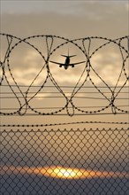 Symbolic image security, passenger aircraft taking off, security fence, Stuttgart Airport,