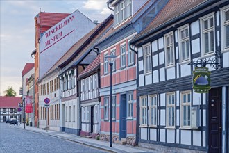 Half-timbered houses in the street Altes Dorf, a street with cobblestones, in the old town centre