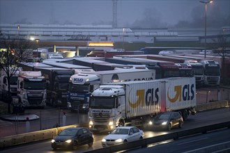 Heavy traffic on the A2 at the Bottrop-Süd service area, overcrowded lorry parking in the evening,