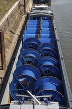 Freighter at the harbour canal, inland port Duisburg-Ruhrort, cargo ship, loaded with empty cable