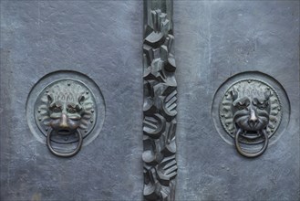 Lion heads as door knockers at the main entrance of St Lorenz, Nuremberg, Middle Franconia,