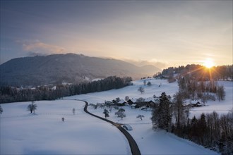 Sunset, Kiefersau am Buchberg in winter, behind Blomberg, drone shot, Tölzer Land, Upper Bavaria,