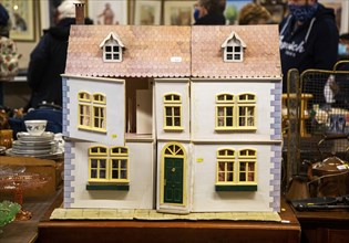 Wooden dolls house on sale at an auction room, UK