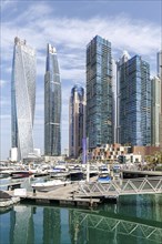 Dubai Marina skyline skyscrapers with yachts property skyscrapers living on the waterfront in