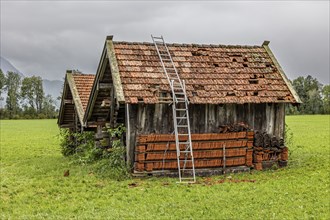 Roof of a small hut destroyed by hail, storm on 26.8.23 near Benediktbeuern, Bavaria, Germany,