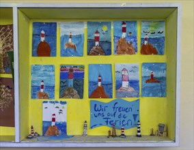 Fourth grade classroom, after school, the building is older but in good condition, art project at