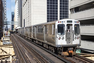 Chicago L Elevated elevated metro train public transport train at the Harold Washington Library