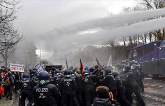 Water cannon in use at the Brandenburg Gate. Once again, thousands of corona deniers are