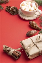 Christmas or New Year composition. Decorations, box, cinnamon, cones, fir and spruce branches, cup