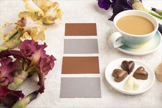 Set of gray and brown business cards with cup of cioffee, chocolate candies, purple and burgundy