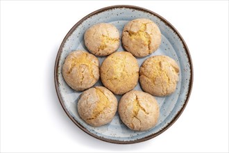 Almond cookies on blue plate isolated on white background. Top view, flat lay, close up