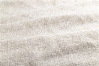 Fragment of white linen tissue. Side view, natural textile background and texture. wave concept,