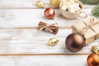 Christmas or New Year composition. Decorations, box, golden balls, cinnamon, fir and spruce