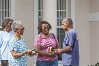 Evangelism team walk door to door to spread the word of God in Ocala, Florida, USA, North America