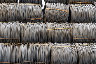 Steel wire, coils, waiting for further processing in the Rhine-Ruhr harbour in Mülheim an der Ruhr,