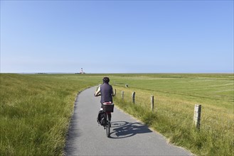 Cycling at the Westerheversand lighthouse, Schleswig-Holstein, Germany, Europe