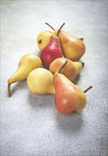 Small pears, Duchess variety, scattered on the table, top view, no people