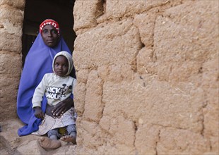 Mother and toddler in a village in the community of Maraban Dare, in the state of Plateau in