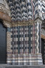 Decorative columns at the main portal of San Lorenzo Cathedral, Piazza San Lorenzo, Genoa, Italy,