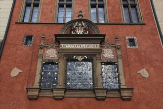 House facade with coat of arms on the historic Old Town Hall on the Old Town Square, Prague, Czech