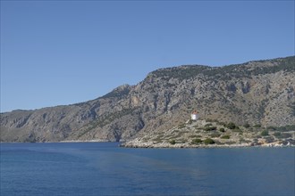 Old windmill on a rock, Bay of Panormitis, Symi, Dodecanese, Greece, Europe