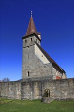 Small Easter fountain in front of the fortified church from the Middle Ages, fortified church,