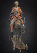 Palm tree donkey around 1380, wooden figure on a dark background, Hohenzollerisches Landesmuseum,