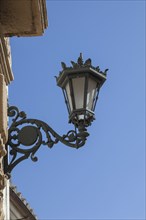 Historic street lamp on a historic house facade, Ronda, Andalusia, Spain, Europe