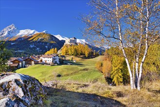 Village view of Tarasp with castle in autumn, Scuol, Canton Graubünden, Switzerland, Europe