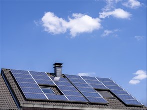 Solar system on the pitched roof of a residential building, photovoltaics for power generation, for