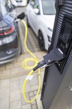 Electric cars at charging stations, Dresden, Saxony, Germany, Europe