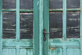 Old dilapidated turquoise door, detail, transom window, wood, wooden door, colour, peeled off,