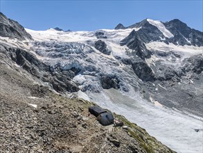 Mountain hut Cabane de Moiry, located close to the retreating Moiry glacier, aerial view, Valais,