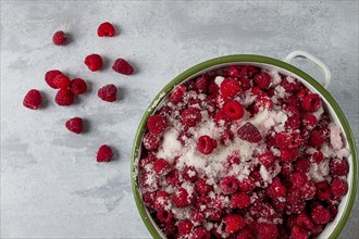 Fresh raspberry berry, covered with granulated sugar, jam preparation, top view, no people